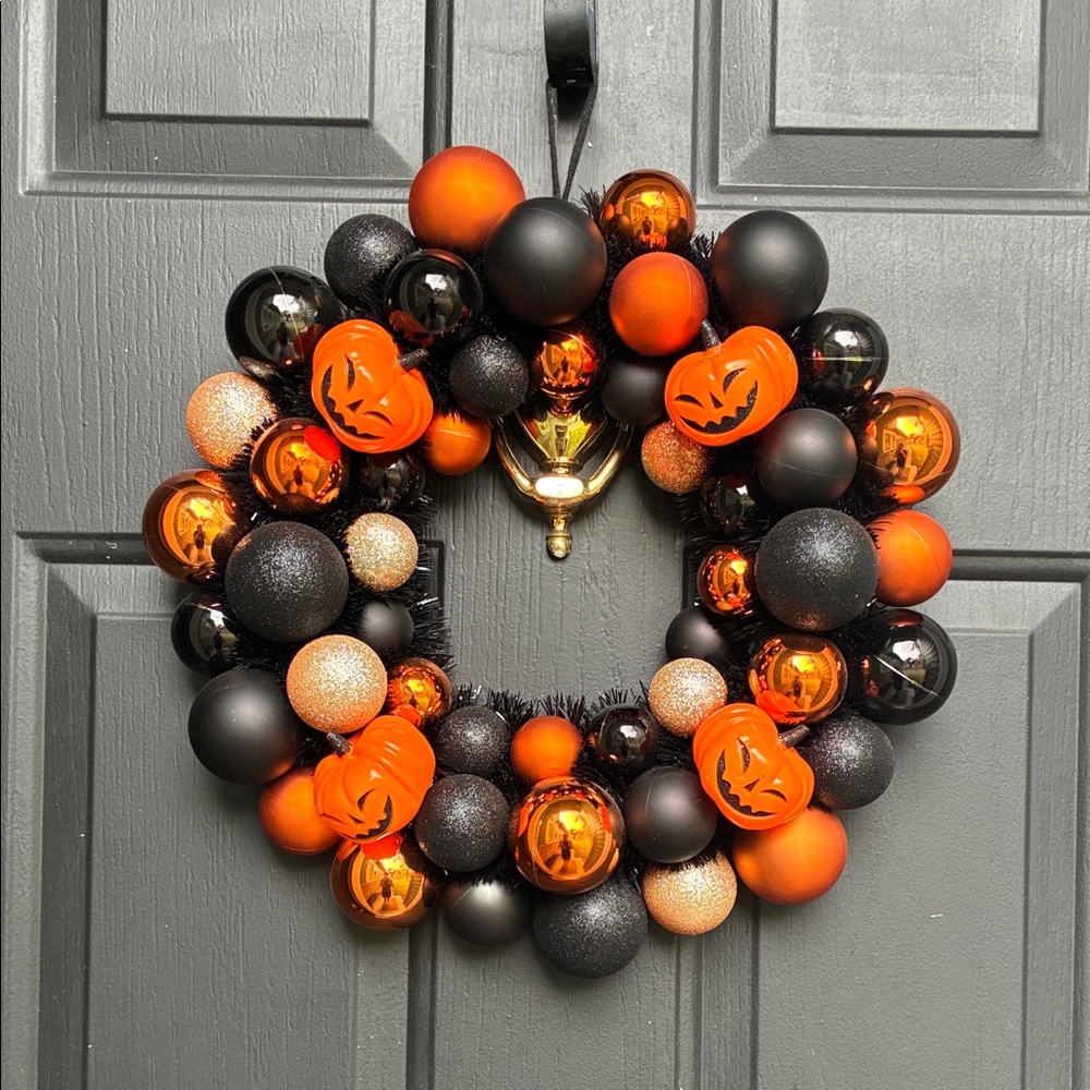 Festive Halloween Wreath with Orange and Black Ornaments